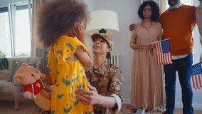 Cinematic video of a woman coming back home from the army military service in the us. Family reunited at lunch time indoor in a beautiful american house. - Powered by Shutterstock - Get 15% off with code: PIKWIZARD15