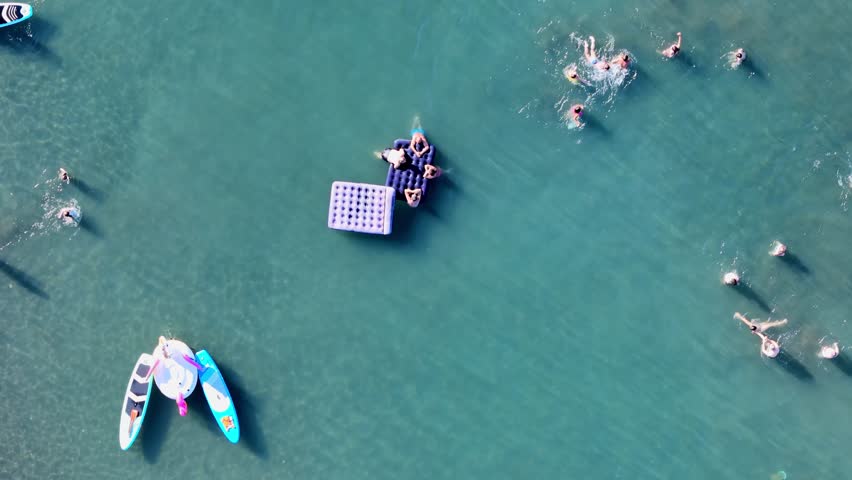 Lifeguards observing swimmers during triathlon competition