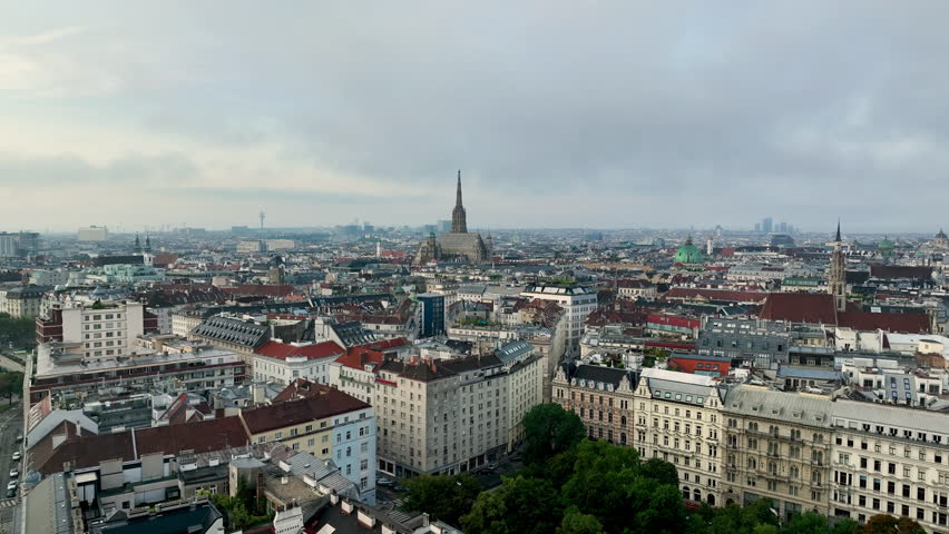 Aerial view of famous places Vienna skyline at sunrise fog, Austria. Old town and new buildings at sunrise river Donau