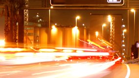 rush of night time traffic on motorway in timelapse scene, barcelona, spain