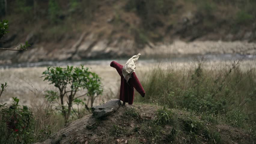 Scarecrow on the riverbank in Gorkha, Nepal