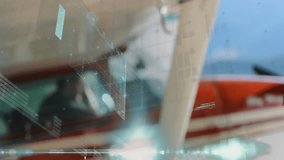 Pilot in cockpit of small aircraft with digital interface animation over window. Aviation, technology, navigation, innovation, flying, controls - Powered by Shutterstock - Get 15% off with code: PIKWIZARD15