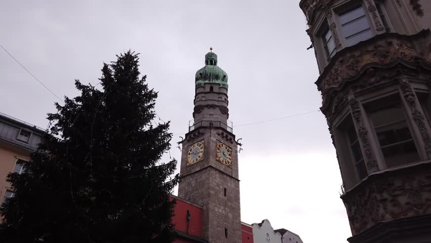 Helbling House and the City Tower in Innsbruck, Austria, across from the Golden Roof (Goldenes Dachl) at Herzog-Friedrich-Strasse Street.