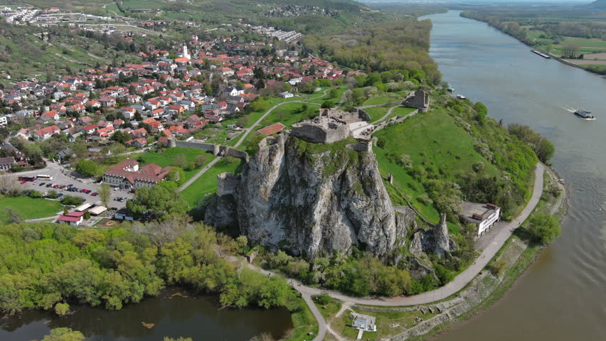 Aerial around view of ruin castle Devin. Confluence of Danube and Morava rivers, Bratislava, Slovakia, 4k
