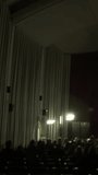 Cinema Hall with Green Screen Display and Blurred View of Audience - Vertical 4K - Powered by Shutterstock - Get 15% off with code: PIKWIZARD15