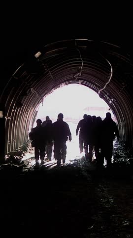 Vertical 4K Video of Coal Miners Leaving the Mine in a Mountainous Landscape