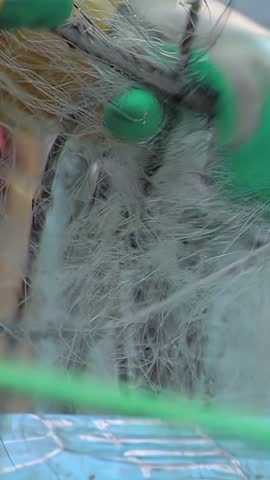 Fisherman in Gloved Hands with Fishing Net on a Boat near Valparaíso - Close Up - Vertical 4K