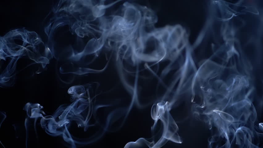 Thin Curls of Blue Smoke Rise Up, Filling Empty Space. Black Background. Incense sticks. Smog. Abstract shapes. Mist. Texture. Clouds of smoke swirl. Floating fog, flowing smoke. Blurred motion.