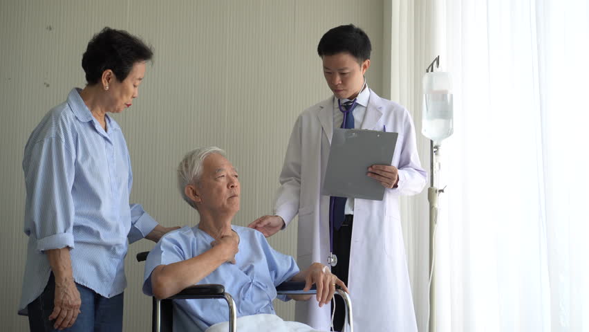 Asian doctor check up on elderly wheelchair patient disease treatment hospital 4k