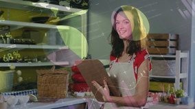 Smiling woman holding clipboard in bakery with data visualization animation over. small business, entrepreneur, analytics, technology, digital, innovation - Powered by Shutterstock - Get 15% off with code: PIKWIZARD15