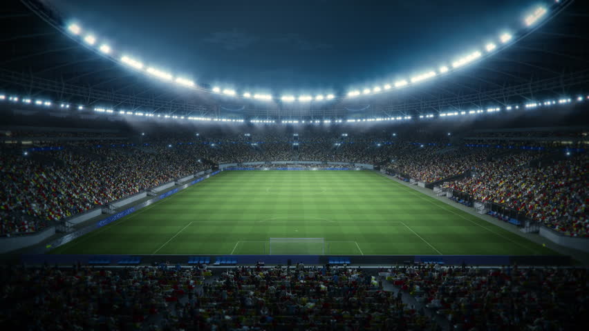 Night View of a Massive Soccer Stadium Filled With Spectators. the Arena Is Packed With Fans Surrounding the Pitch, With a Goal Visible. Thousands of Supporters at Major Sport Event. Static Wide Shot