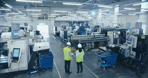 Two Engineers in Safety Vests Use a Tablet to Interact With Holographic Data in a High-tech Factory, Activate AI Facility Analysis, Advanced Machinery, Digital Interfaces, Futuristic Manufacturing - Powered by Shutterstock - Get 15% off with code: PIKWIZARD15
