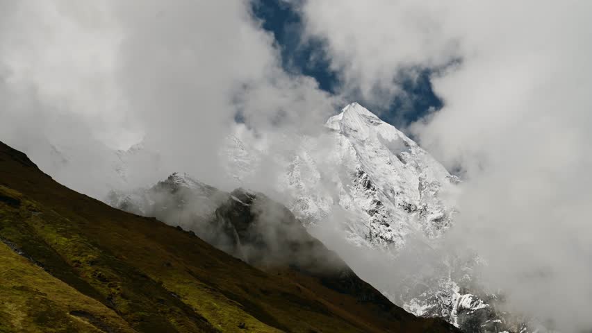Snowcapped Mountains in the Clouds in Nepal, Himalayas Mountain Landscape in High Altitude Terrain in Beautiful Nepal Scenery
