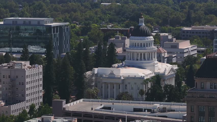 California State Capitol building on a sunny day in Sacramento. The California State Capitol stands as a historic edifice, combining neoclassical architecture with the functions of state government.