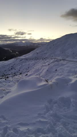 crown range snow hillsQueenstown New Zealand social influencer stock footage