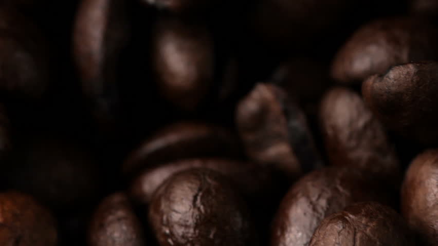 Macro HD video of rotating coffee beans