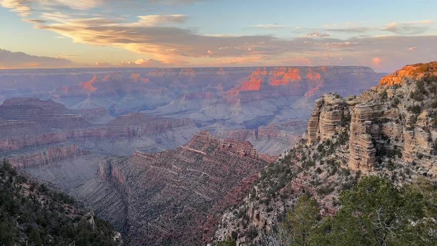 Grand Canyon National Park sunset timelapse filmed in Arizona. This beautiful 4K footage features a stunning blue hour and golden hour sunset over the iconic canyon with its majestic rock formations.