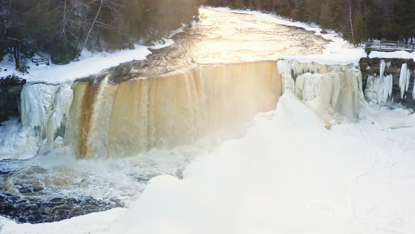 Great Waterfall Starting to Freeze Over Sunset