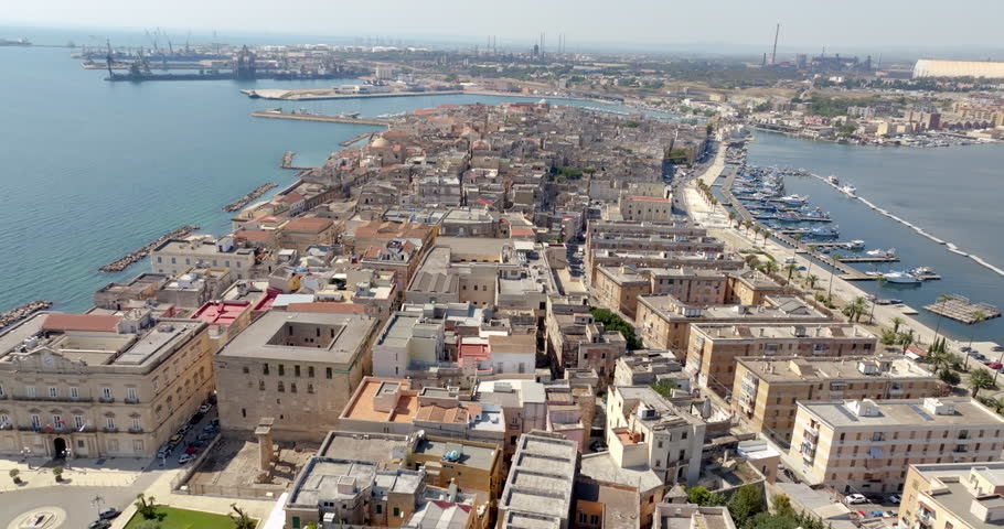 Aerial view of the old town of Taranto, Puglia, Italy. In background is the ILVA plant.