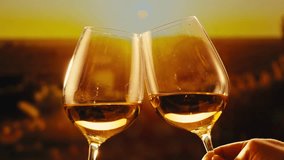 Orange or white wine bottle and glass against a sunset in a peaceful vineyard, pouring of ecological natural wine.  - Powered by Shutterstock - Get 15% off with code: PIKWIZARD15