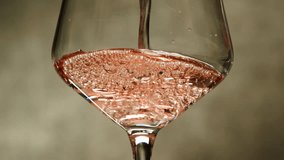 Rose Orange or white wine bottle and glass against a sunset in a peaceful vineyard, pouring of ecological natural wine. Cheers, hands with wine glasses, drinking alcohol. - Powered by Shutterstock - Get 15% off with code: PIKWIZARD15