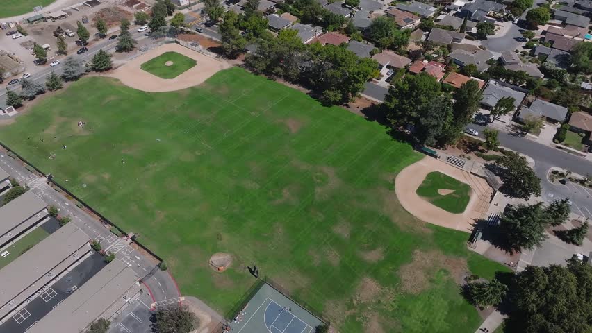 Aerial view of a baseball field in a public park near a suburban residential neighborhood in San Francisco, USA.