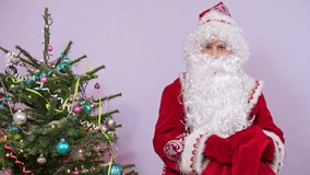 A traditional santa claus in a red suit stands beside a festive christmas tree adorned with colorful ornaments. - Powered by Shutterstock - Get 15% off with code: PIKWIZARD15