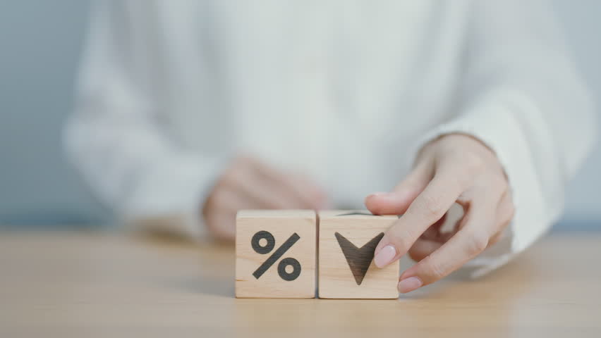 wood block of percentage change to UP and Down arrow. Interest rate, GDP, stocks market, financial, deflation and Inflation, ranking, mortgage, debt, Loan and Economic Recession concept