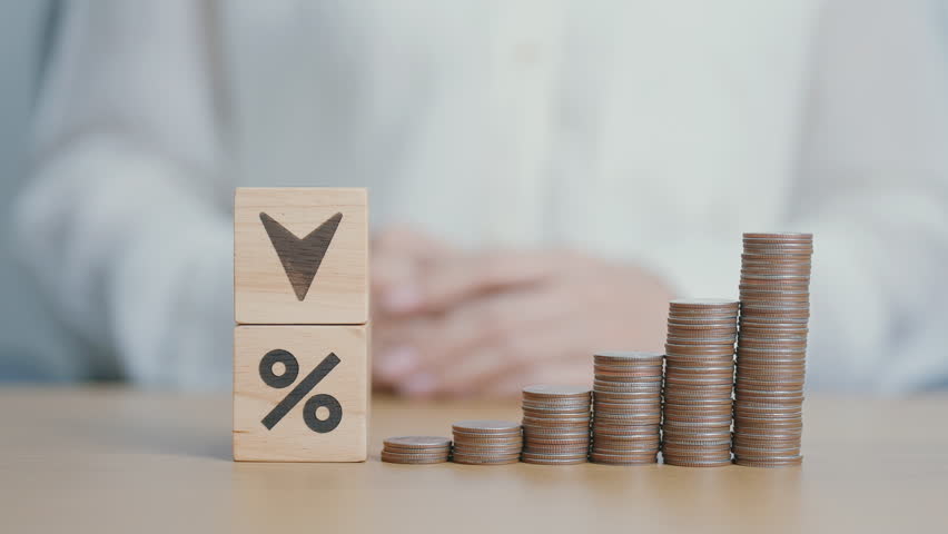 wood block of percentage change to UP and Down arrow with money coins stack. Interest rate, GDP, stocks market, financial, deflation and Inflation, ranking, mortgage, debt, Loan and Economic Recession