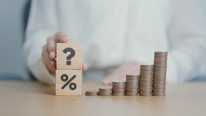 wood block of Question mark, coin stack and Percentage. Interest rate, GDP, stocks market, financial, deflation and Inflation, ranking, mortgage, debt, Loan and Economic Recession