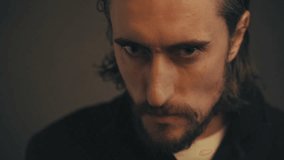 Suspicious Gaze: Handsome Man's Emotional Shift in Slow Motion Close-Up - Powered by Shutterstock - Get 15% off with code: PIKWIZARD15
