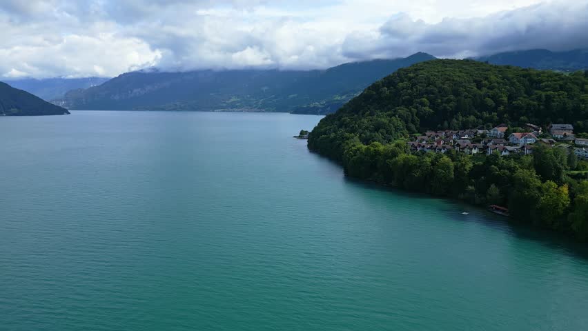 Push in drone shot of the bay near Spiez with Thun lake in Canton of Bern in Switzerland.