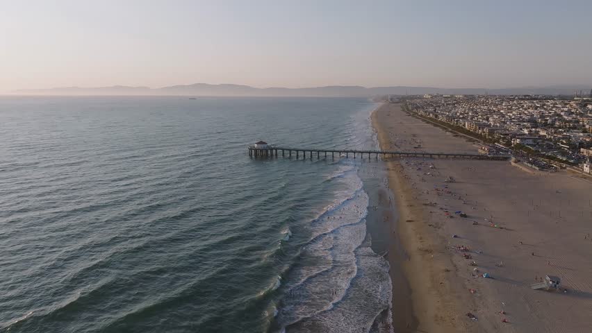 Aerial View over Manhattan Beach in California with Green Blue Water and Blue Sky. Beautiful Manhattan Beach pier in California USA