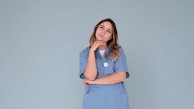 Curious Doctor Or Nurse Thinking And Having Brilliant Idea On Gray Background - Powered by Shutterstock - Get 15% off with code: PIKWIZARD15