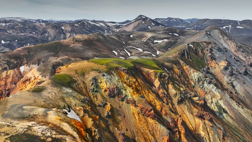 Aerial view of colorful rhyolite mountains, fields of solidified lava and river beds in Landmannalaugar, part Fjallabak Nature Reserve, Iceland. Icelandic highlands, Landmannalaugar hiking area 