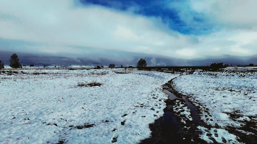 Aerial footage of a rare snowfall in the Midlands region of KwaZulu-Natal, South Africa.  Perfect for travel, nature, and weather-related content, this footage brings the unexpected beauty of snow.