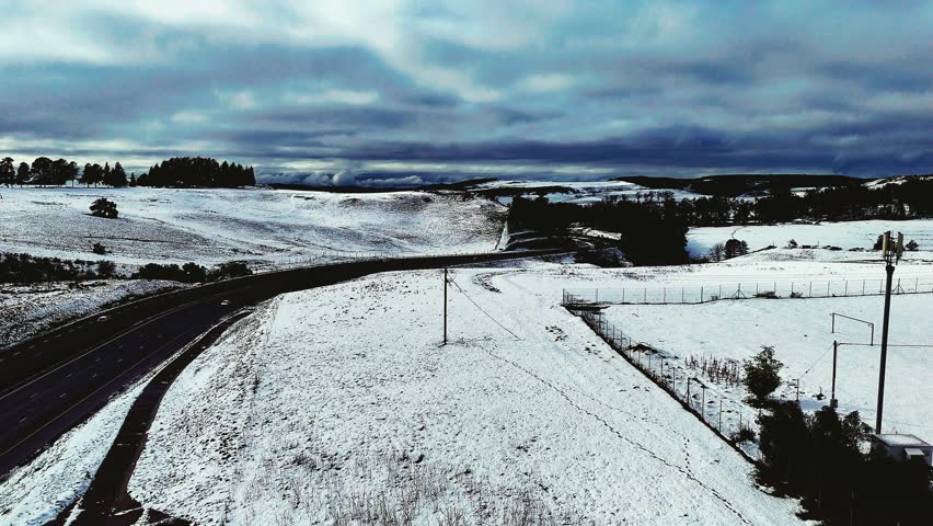 Aerial footage of a rare snowfall in the Midlands region of KwaZulu-Natal, South Africa.  Perfect for travel, nature, and weather-related content, this footage brings the unexpected beauty of snow.