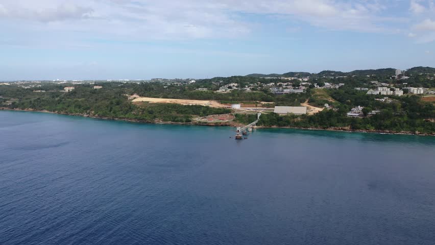 A drone footage over landscape La Perla neighborhood houses in San Juan Puerto Rico with gray sky