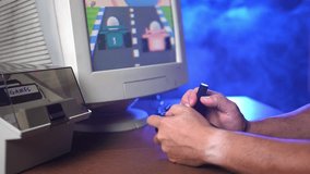 A nostalgic gaming session featuring a classic racing game on a vintage monitor. The player's focused hands grip the joystick amidst a moody blue-lit atmosphere. Gameplay is fictional and released.  	 - Powered by Shutterstock - Get 15% off with code: PIKWIZARD15