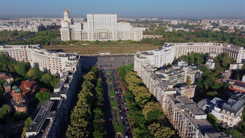 Palace of the Parliament (Casa Poporului in Romanian) from above. Aerial 4K video with this landmark from Bucharest, one of the biggest buildings in the world. Travel to Romania.