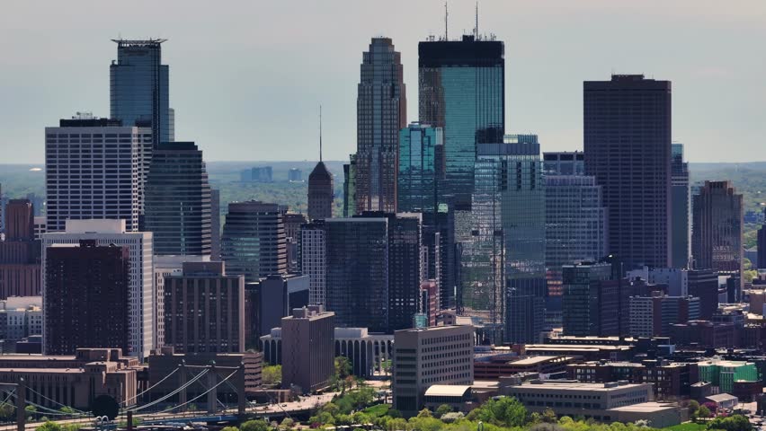 A drone shot of the neighborhood and houses near Downtown Minneapolis Skyline in Minnesota in the summertime