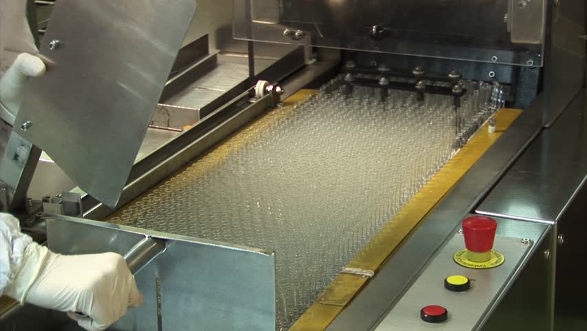 Automated production of medicines. Placing on the conveyor glass, containers for