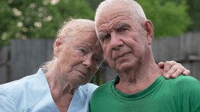 Portrait of elderly married couple. Support for loved ones in difficult times. Loneliness in retirement. Husband and wife together. Old people. Nursing home. Sad thoughtful look. - Powered by Shutterstock - Get 15% off with code: PIKWIZARD15