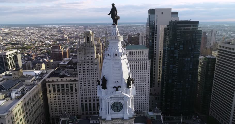 Statue of William Penn on Philadelphia City Hall Tower. Beautiful Cityscape. Business District and Downtown. Sunlight. Delaware River. Pennsylvania 4k