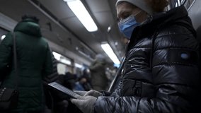 Protection against viral infections in public transport. Disease outbreak, coronavirus covid-19 pandemic, virus protection, quarantine. Keeps social distancing, cares about health, commutes by subway. - Powered by Shutterstock - Get 15% off with code: PIKWIZARD15