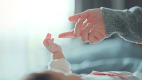 Close-up little hand of child baby holding hand of mother, A newborn holds on to mom's, dad's finger, Love and relationship with infant, Care and support, Dreaming and protection - Powered by Shutterstock - Get 15% off with code: PIKWIZARD15