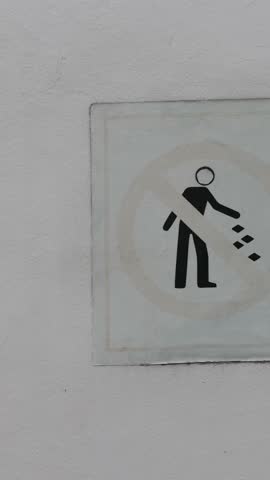 NO LITTERING sign in the strictly regulated city of Singapore. Heavy fines. Authorities protect the city from litter pollution.