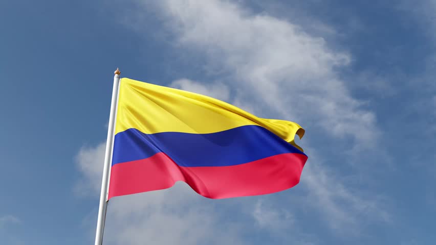 Flag of colombia on a blue sky, flag on a flag pole waving in the wind, american country, national symbol of colombia, video of a flag	
