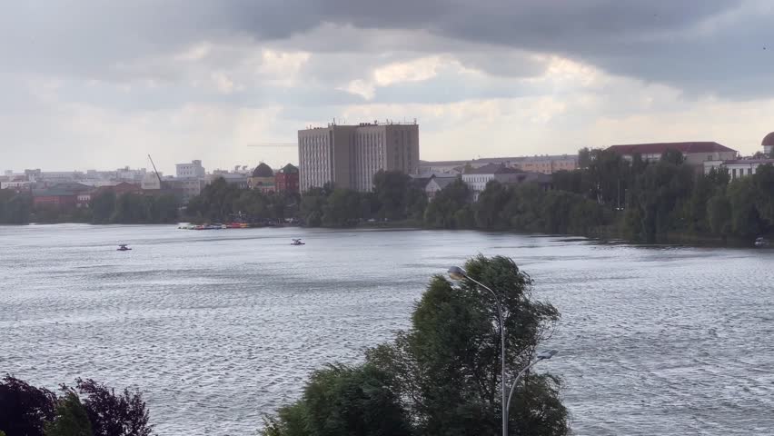 Heavy rain with hail over city lake