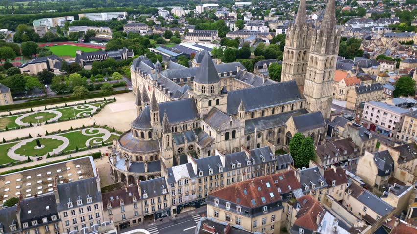 Abbey of Saint-Étienne or Abbaye aux Hommes or Abbey men, Caen in Normandy, France. Aerial drone backward orbiting